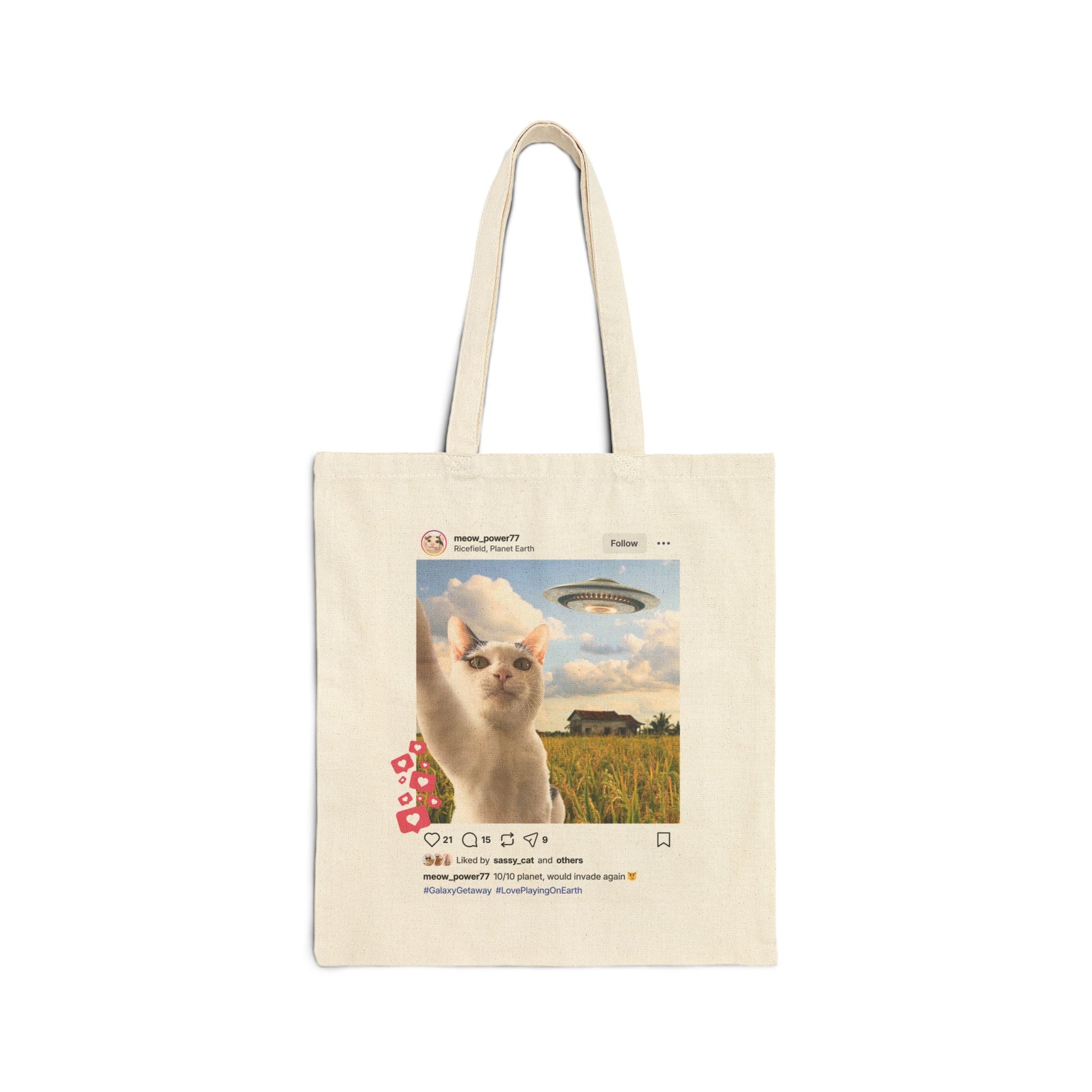 Tote bag with a social media post of an alien cat taking a selfie on earth and caption "10 out of 10, would invade again" on a white background