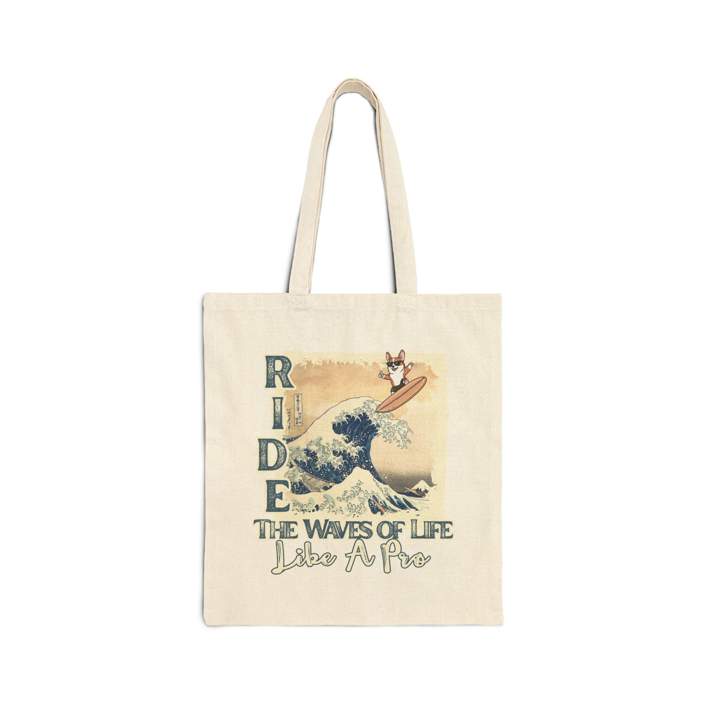 Tote bag with a surfing corgi dog graphic and text "Ride The Waves of Life Like A Pro" on a white background