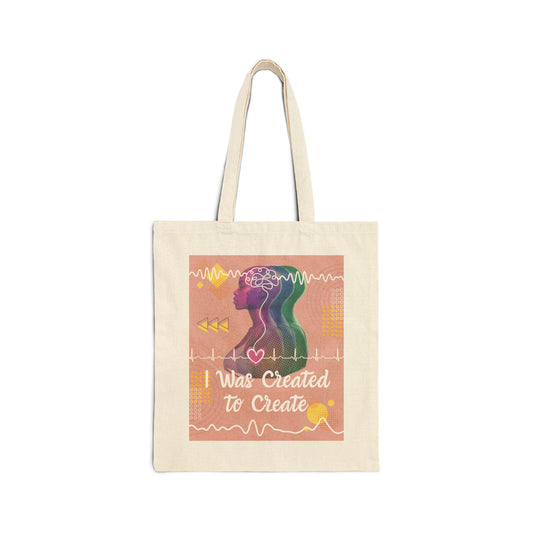 Tote bag with brain waves and heart rhythm and other colorful doodles and text "I Was Created to Create" on a white background