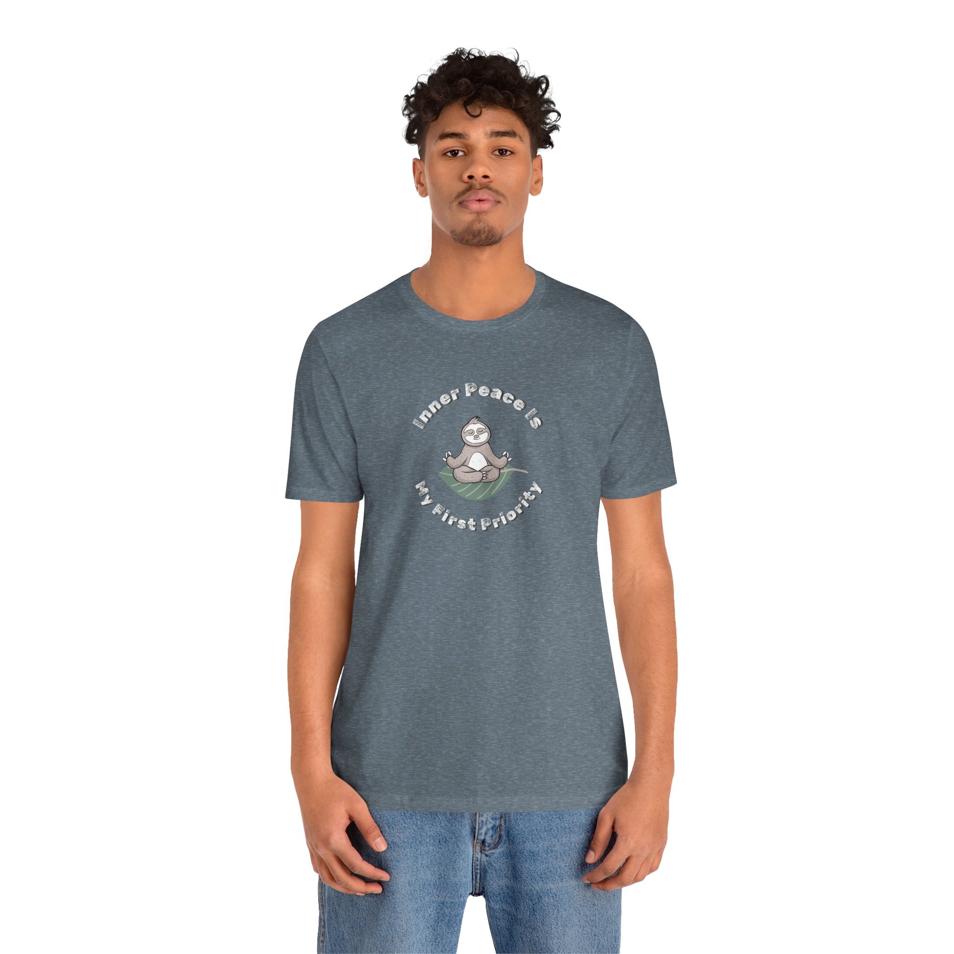 Man wearing a blue t-shirt with a graphic of meditating sloth and text 'Inner peace is my first priority' on a white background