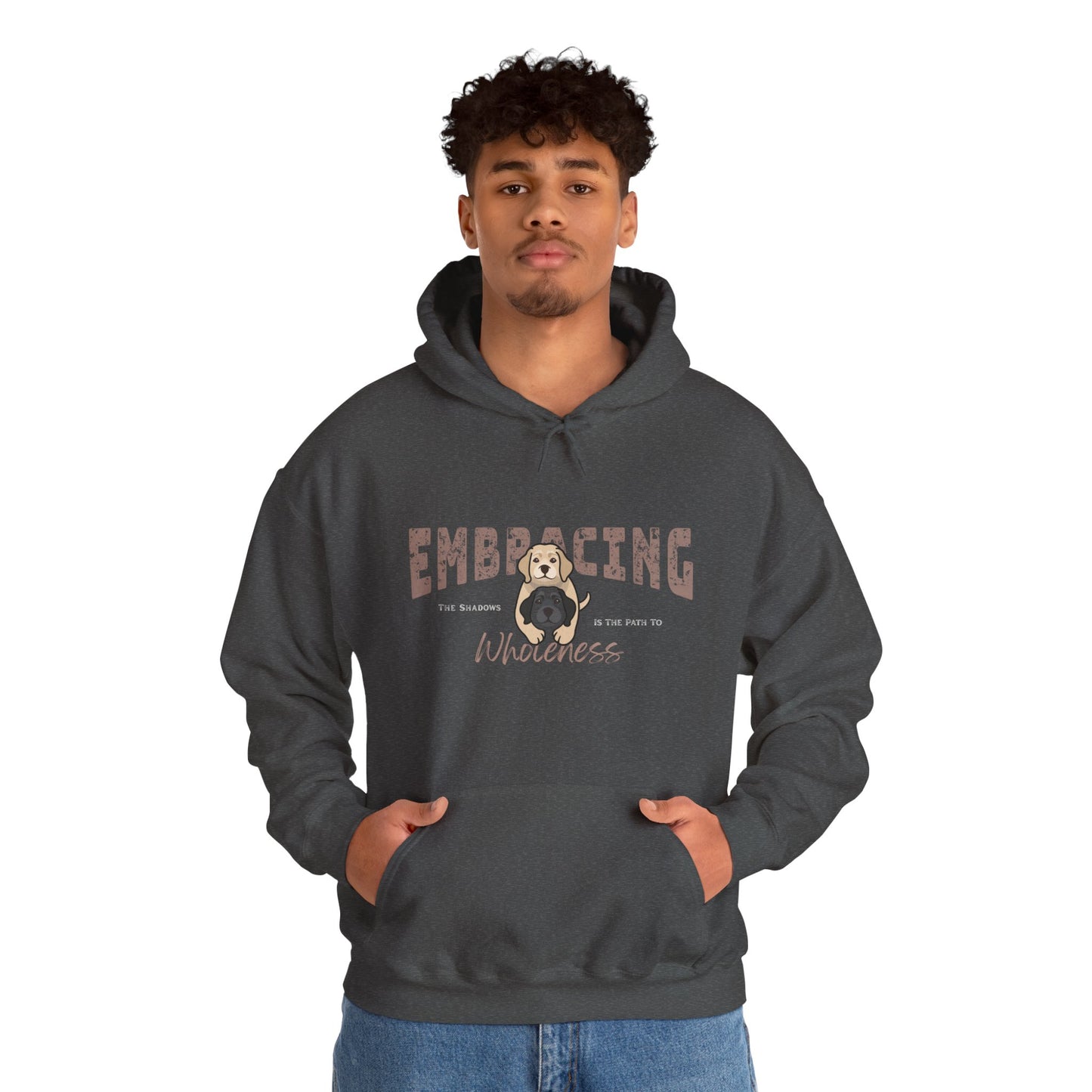 Man wearing a dark gray hoodie with a graphic of yellow Labrador Retriever hugging black Labrador Retriever and text 'Embracing the shadows in the path to wholeness' on a white background