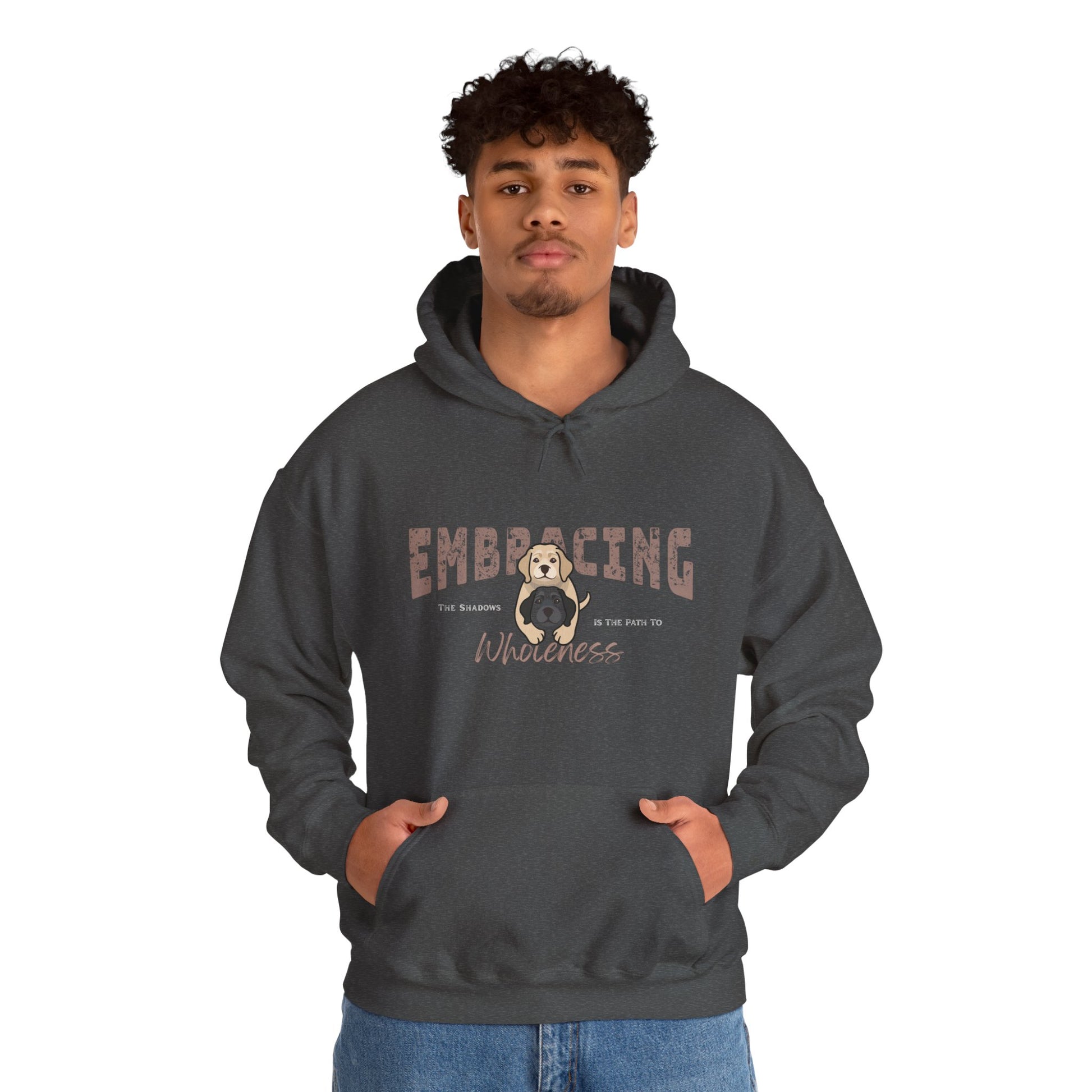 Man wearing a dark gray hoodie with a graphic of yellow Labrador Retriever hugging black Labrador Retriever and text 'Embracing the shadows in the path to wholeness' on a white background