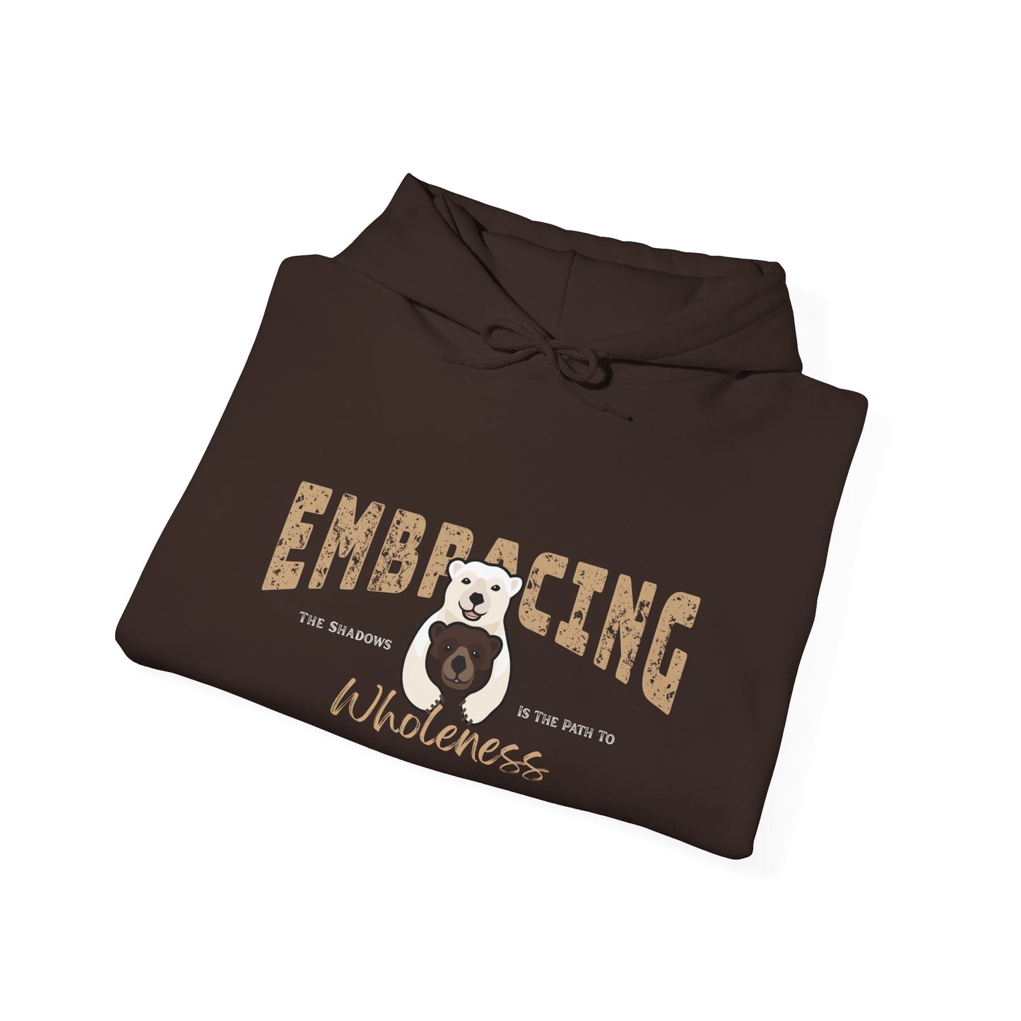 Folded chocolate brown hoodie with a graphic of polar bear hugging brown bear and text 'Embracing the shadows is the path to wholeness' on a white background