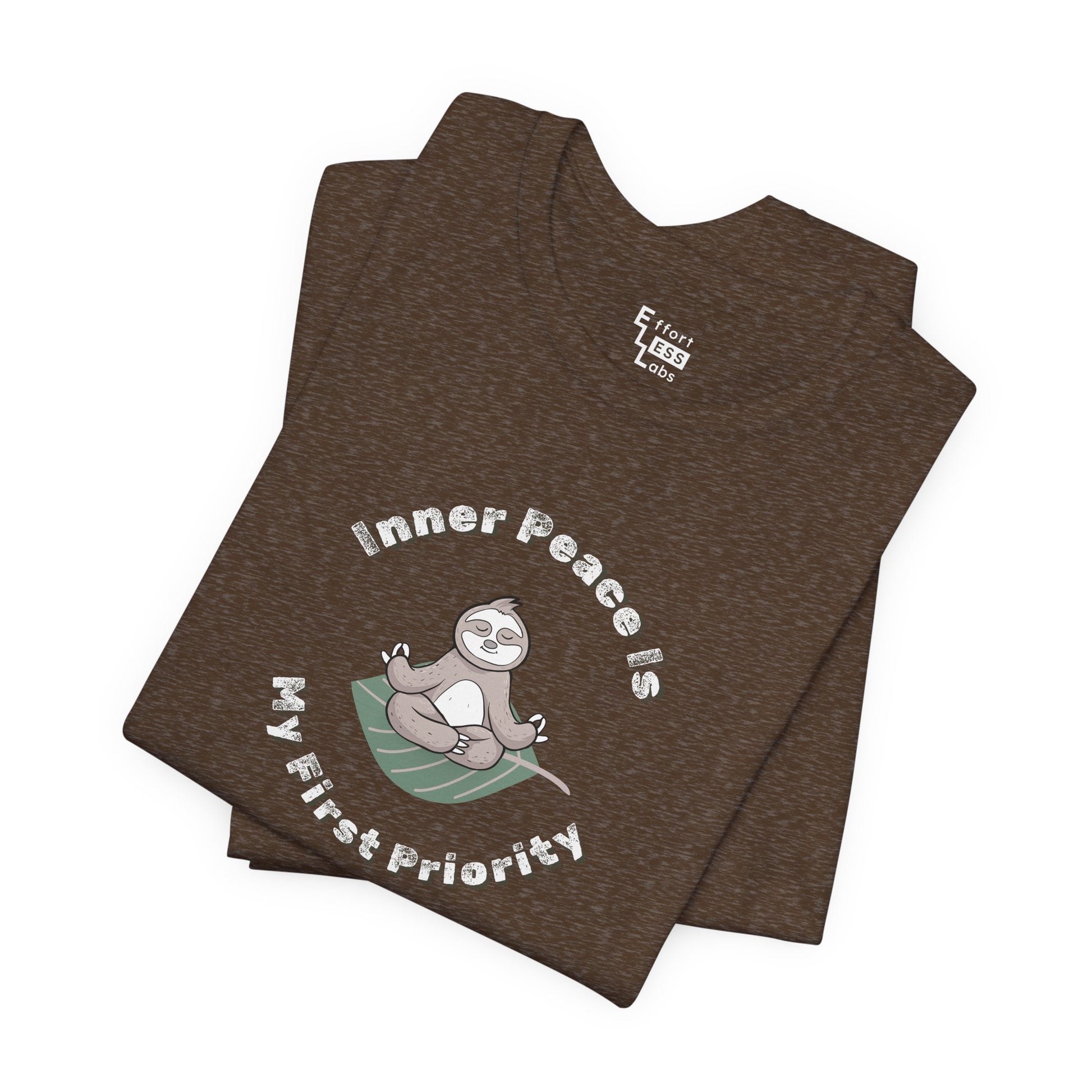 Folded brown t-shirt with a meditating sloth graphic and text 'Inner peace is my first priority' on a white background