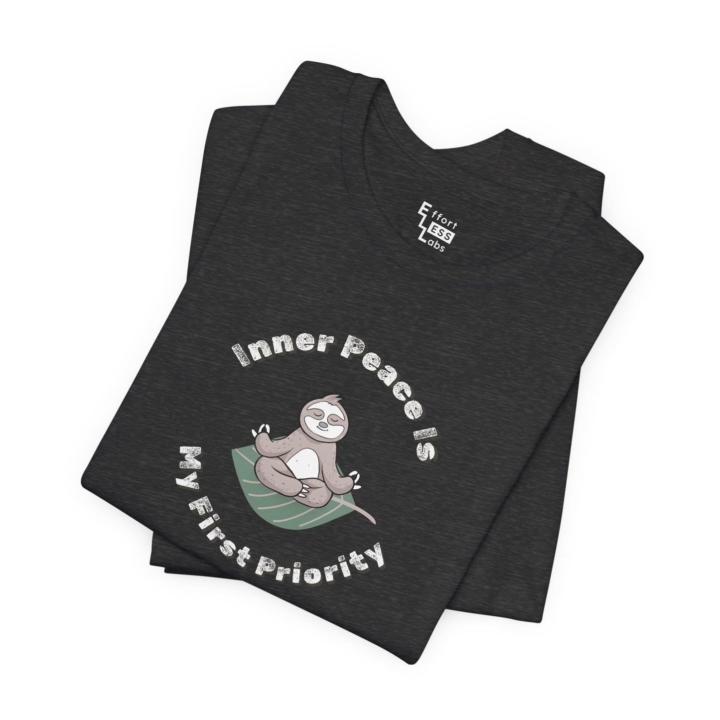 Folded dark grey t-shirt with a meditating sloth graphic and text 'Inner peace is my first priority' on a white background