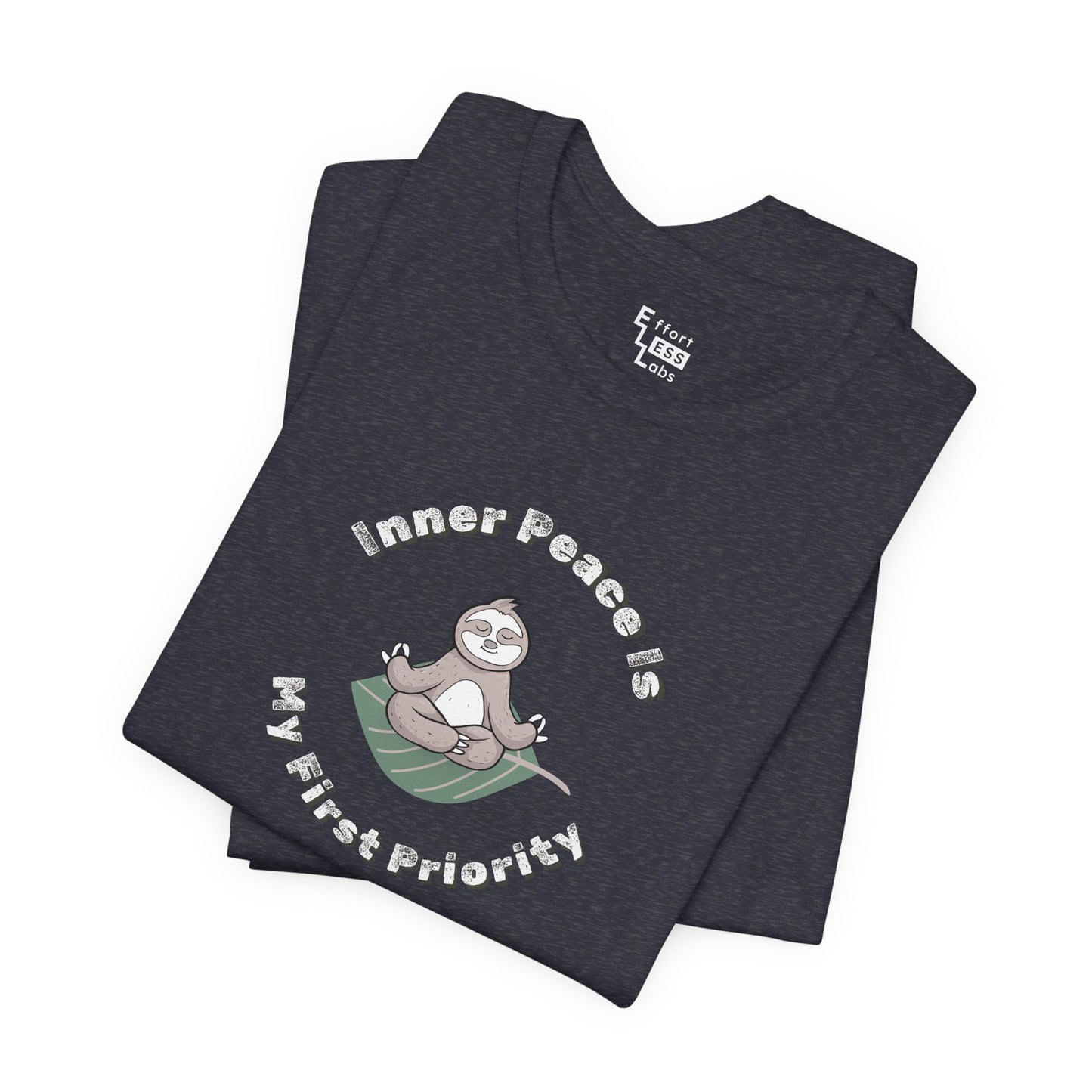 Folded navy t-shirt with a meditating sloth graphic and text 'Inner peace is my first priority' on a white background