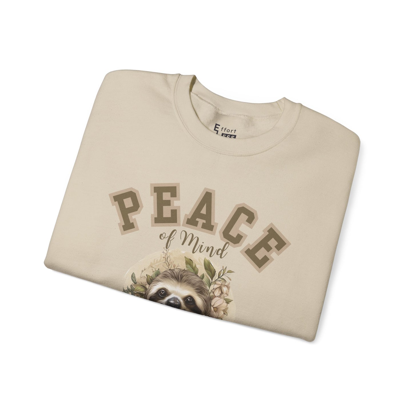 Folded sand beige sweatshirt with a floral sloth graphic and text 'Peace of Mind' on a white background