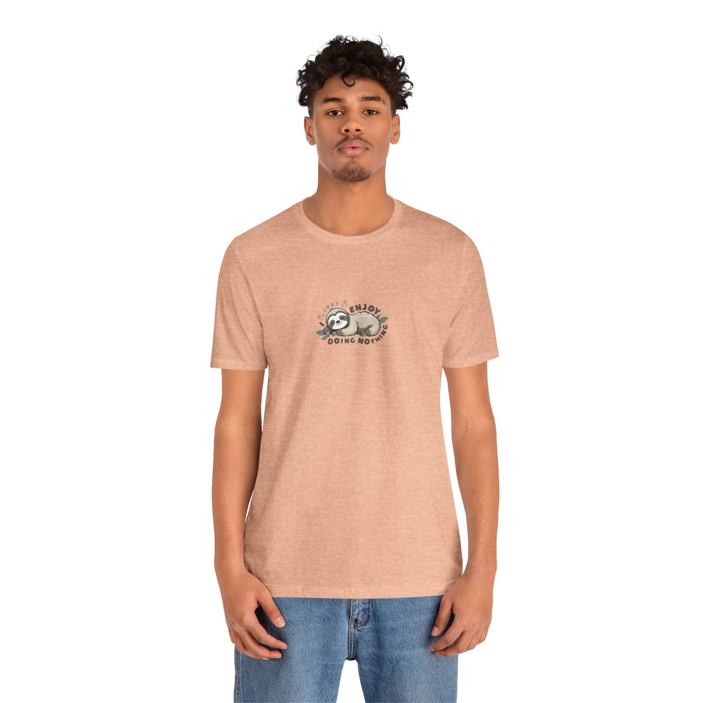 Man wearing peach-colored t-shirt with a sloth graphic and text 'I just enjoy doing nothing' on a white background