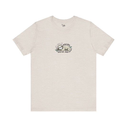 Almond beige t-shirt with a sleeping sloth graphic and text 'I just enjoy doing nothing' on a white background