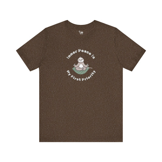 Brown t-shirt with a graphic of a sloth meditating and text 'Inner peace is my first priority' on a white background