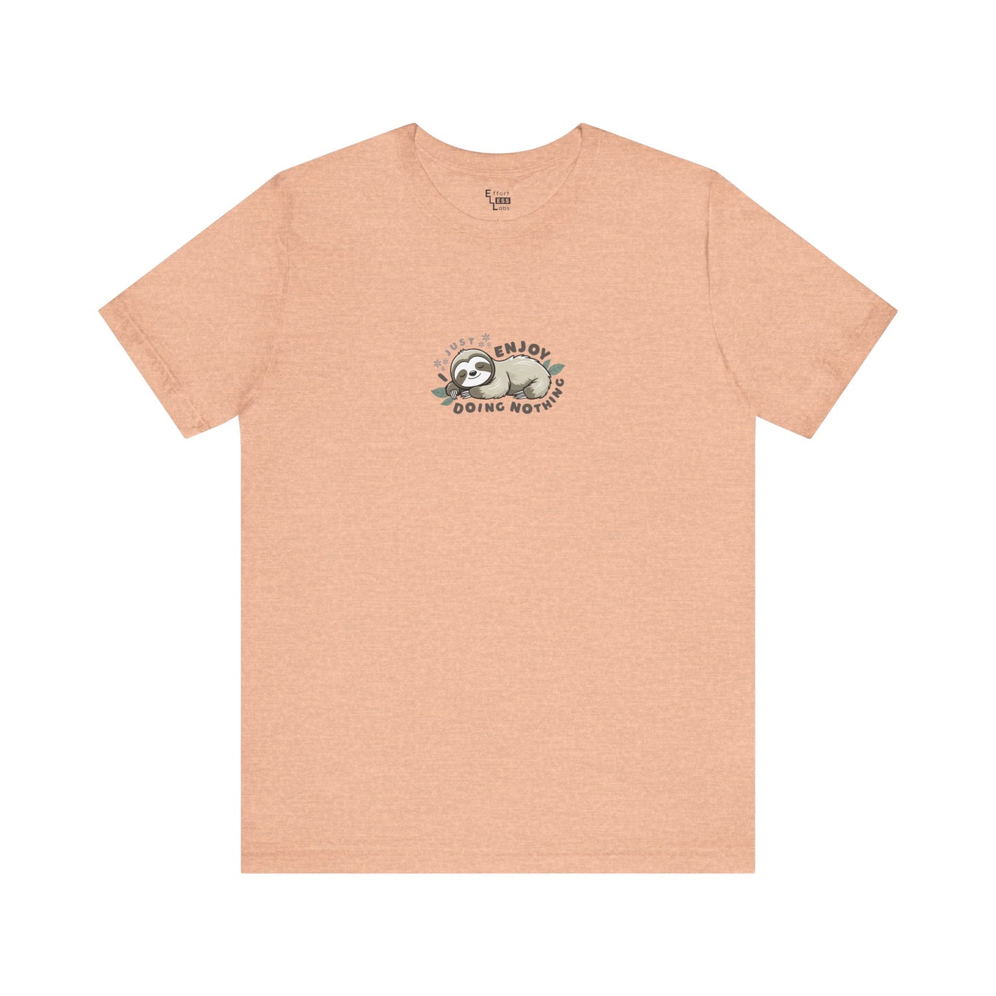 Peach-colored t-shirt with a sleeping sloth graphic and text 'I just enjoy doing nothing' on a white background